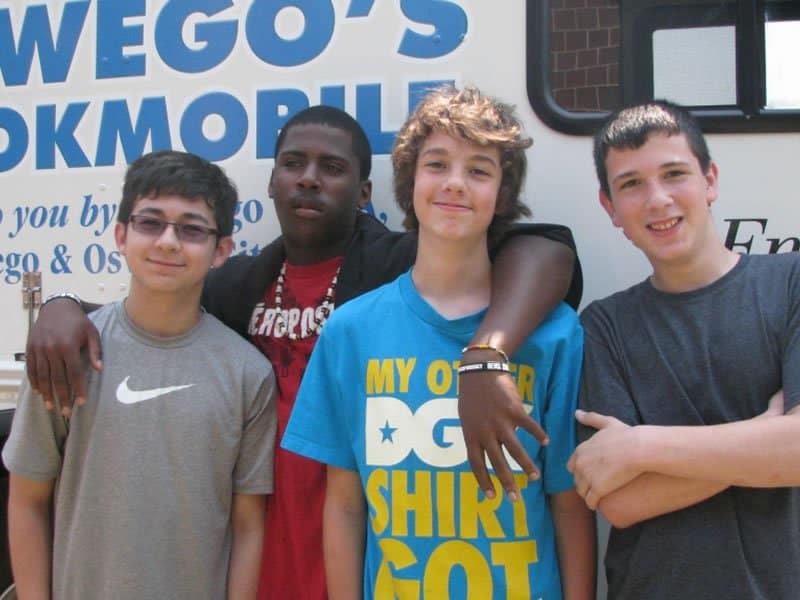 Four Kids in front of bookmobile